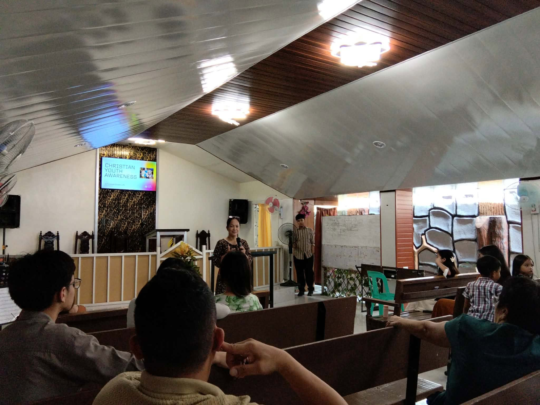 Ruth speaking to young people at a community awareness event